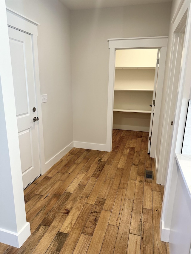 corridor featuring light hardwood / wood-style flooring