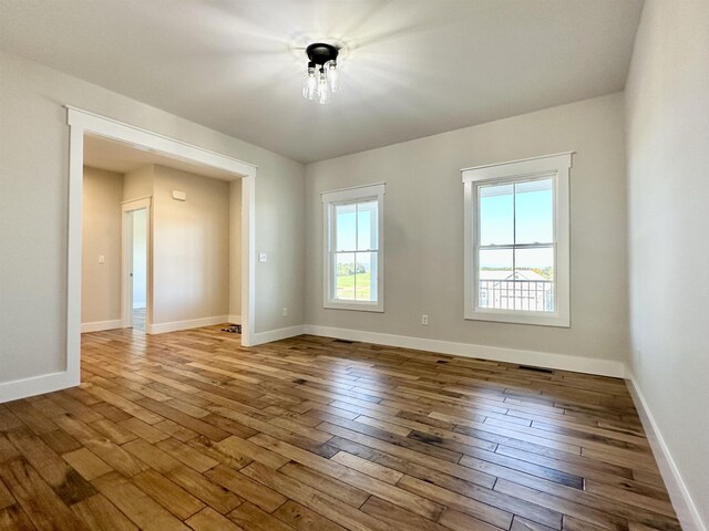 unfurnished room featuring light wood-type flooring