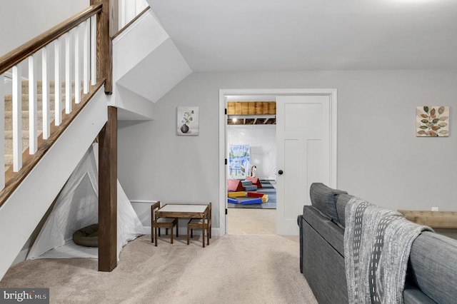 carpeted living room featuring stairs