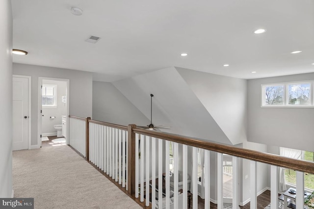 hallway with recessed lighting, baseboards, and carpet floors