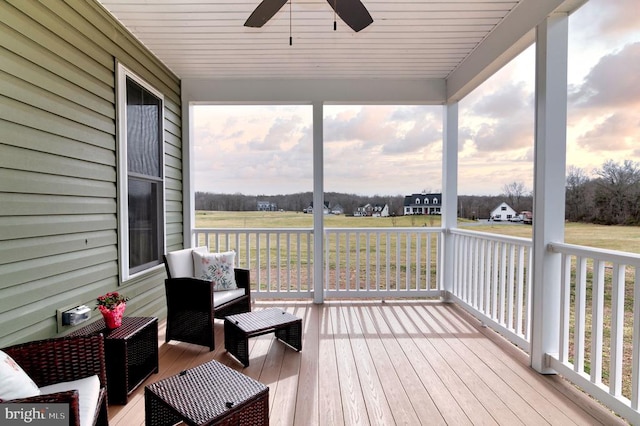 sunroom / solarium with ceiling fan