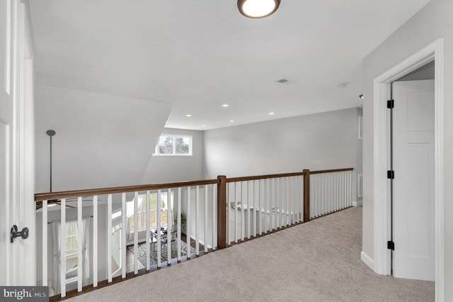 hallway featuring recessed lighting and carpet flooring