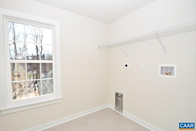 clothes washing area with washer hookup, plenty of natural light, and hookup for an electric dryer