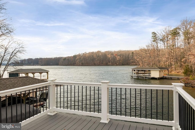 dock area with a water view and a forest view