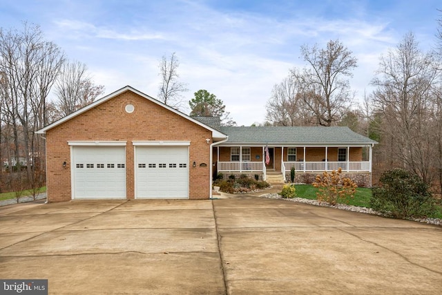 ranch-style home with driveway, an attached garage, a porch, and brick siding