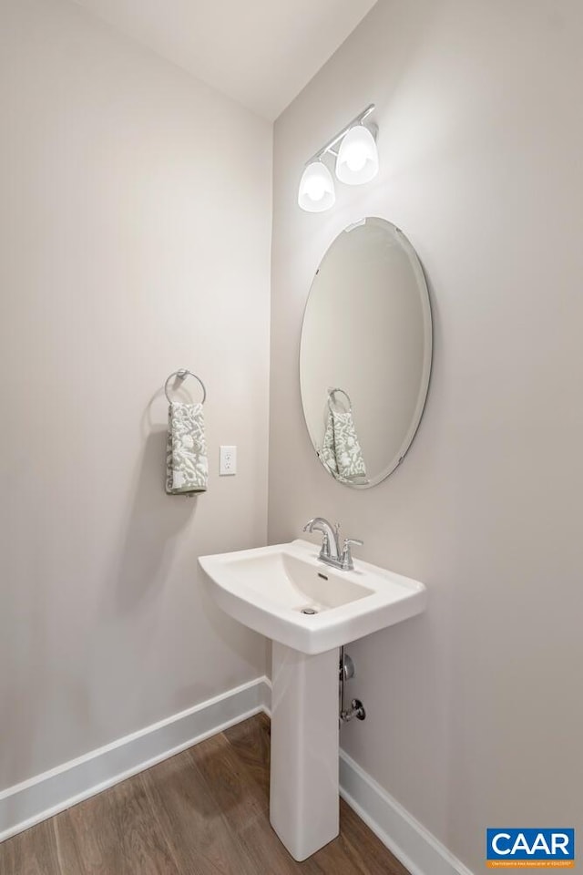 bathroom with hardwood / wood-style flooring