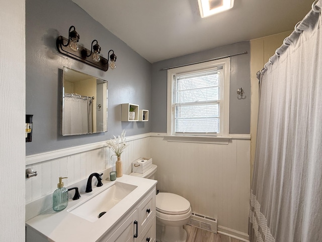 bathroom featuring hardwood / wood-style flooring, vanity, and toilet