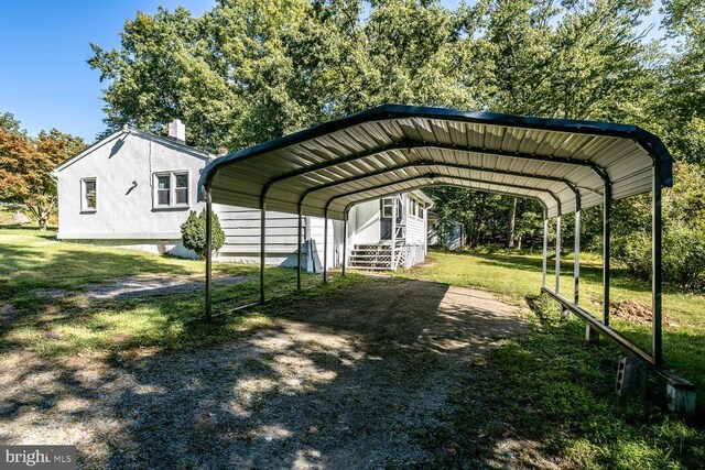 view of vehicle parking featuring a carport and a lawn