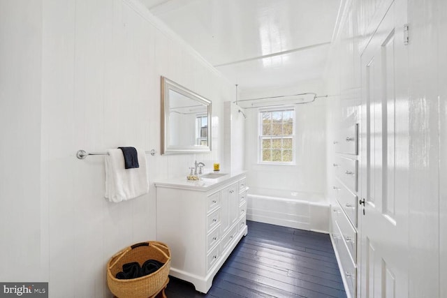 full bathroom featuring bathtub / shower combination, vanity, and hardwood / wood-style floors