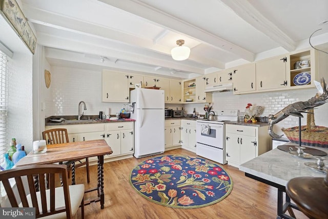 kitchen featuring under cabinet range hood, white appliances, a sink, beam ceiling, and open shelves