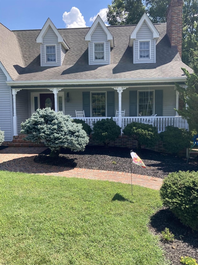 view of front facade with a porch and a front lawn