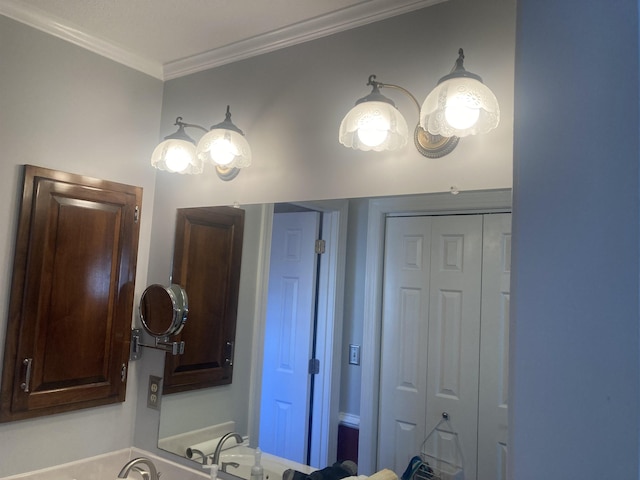 bathroom with ornamental molding and a closet