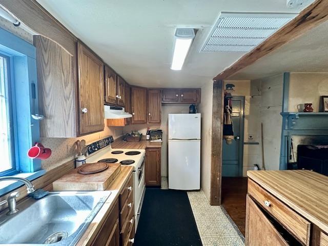 kitchen with white appliances and sink