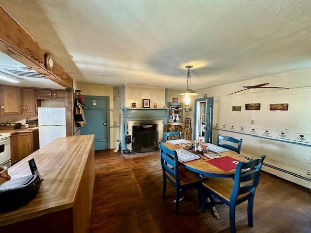 dining area with dark wood-type flooring