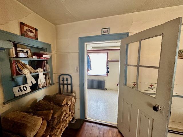 interior space featuring hardwood / wood-style flooring and radiator