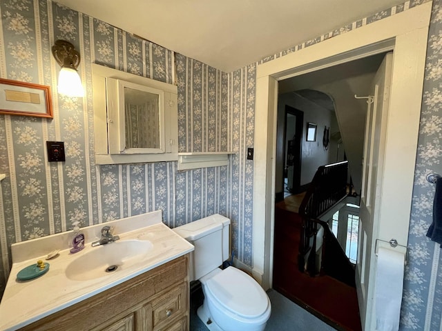 bathroom featuring vanity and toilet