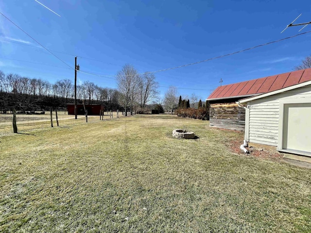 view of yard with a fire pit