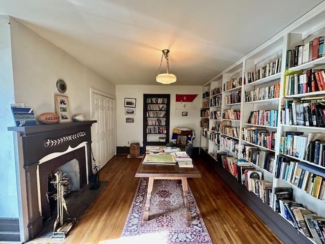 sitting room with dark hardwood / wood-style flooring