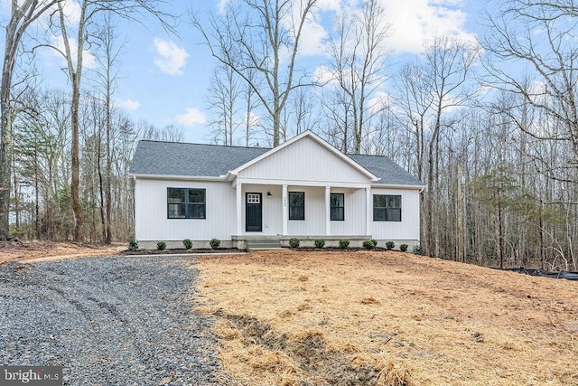 modern inspired farmhouse featuring covered porch