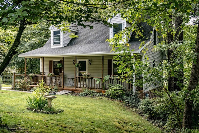 view of front of house featuring a front yard and covered porch