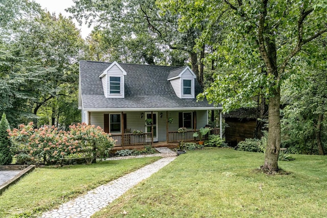 cape cod-style house with a front lawn and a porch