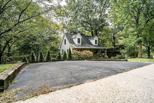 view of side of home with a porch