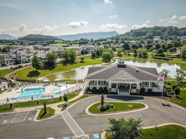 bird's eye view featuring a residential view and a water and mountain view
