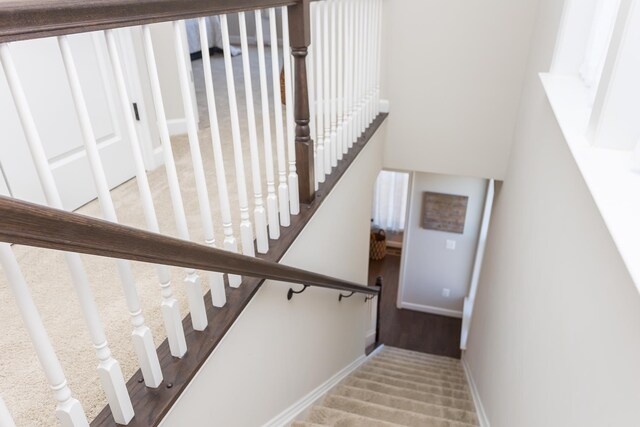 stairs featuring baseboards
