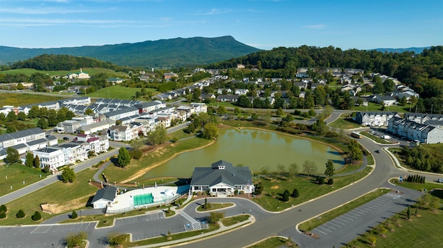 birds eye view of property featuring a water and mountain view