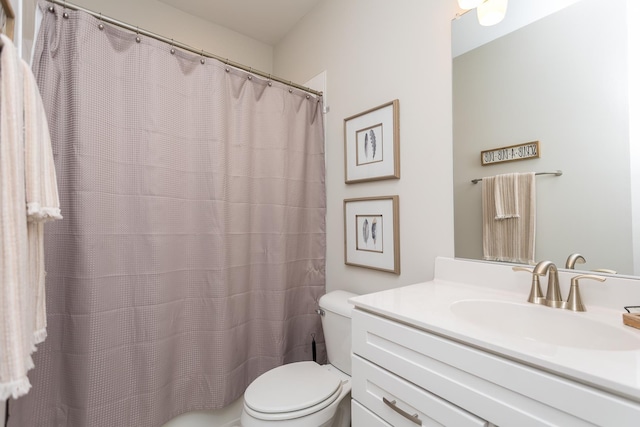 full bathroom with vanity, toilet, and a shower with curtain