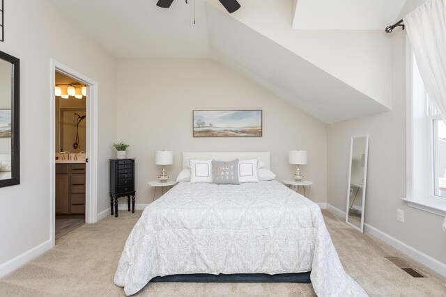 bedroom with baseboards, visible vents, light carpet, and lofted ceiling