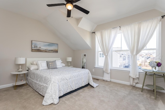 bedroom with baseboards, carpet, and vaulted ceiling