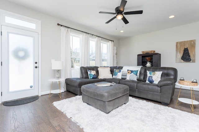 living area featuring recessed lighting, baseboards, a ceiling fan, and dark wood-style flooring