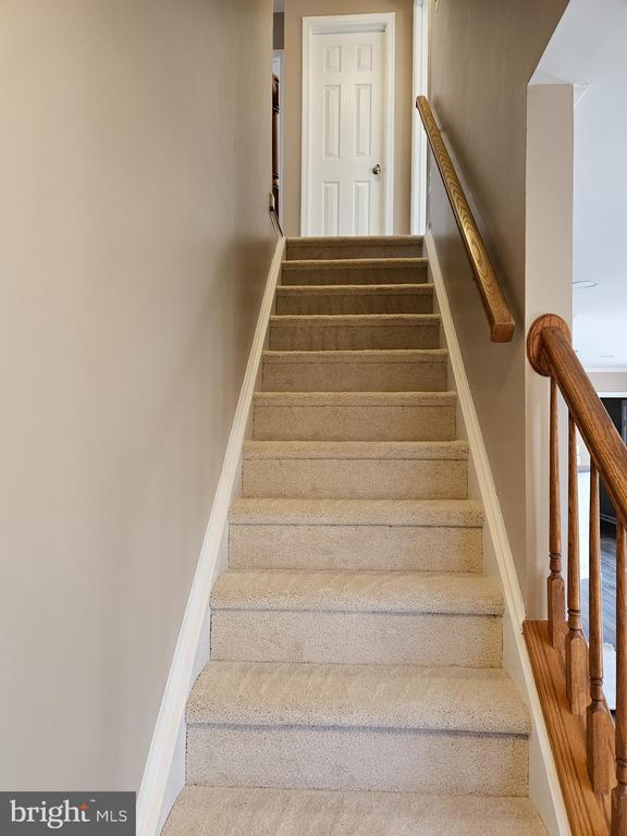 stairway with baseboards