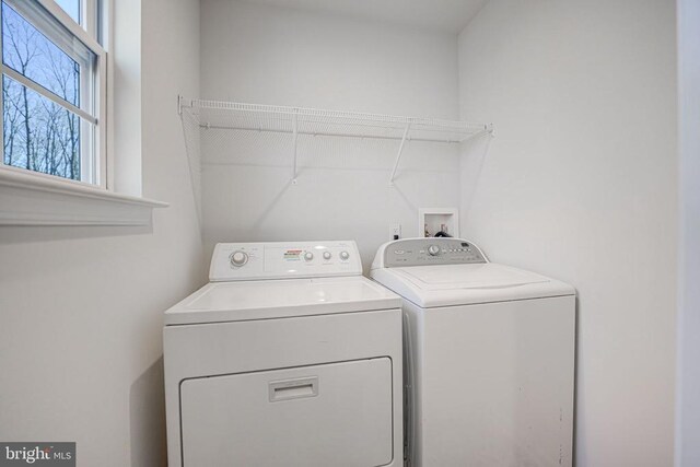 washroom featuring laundry area and independent washer and dryer