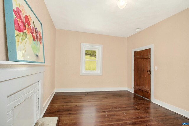 unfurnished room with dark hardwood / wood-style floors