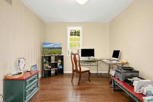 home office with hardwood / wood-style floors