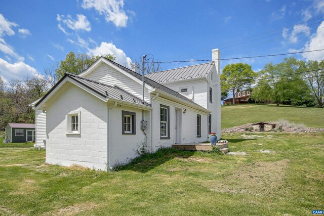 view of home's exterior featuring a yard