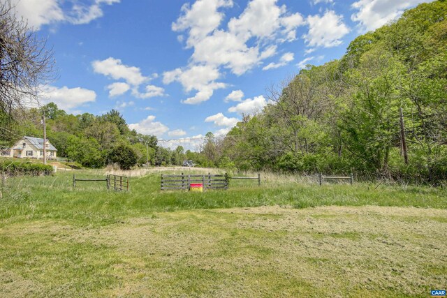 view of yard with a rural view