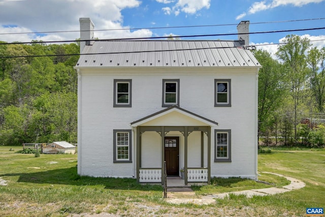 view of front of property with a front lawn