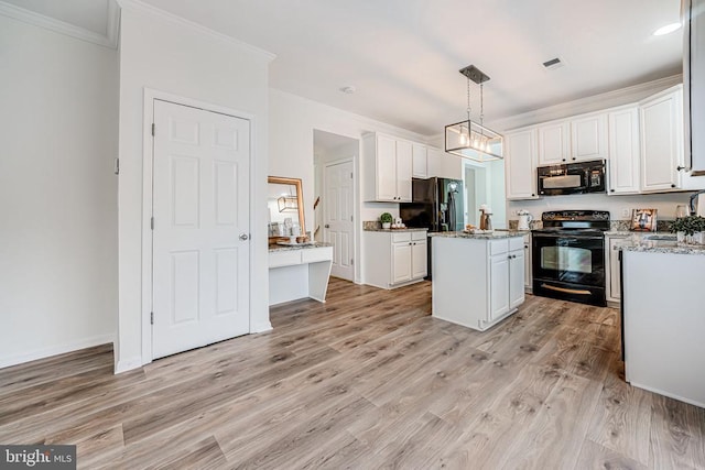 kitchen featuring crown molding, white cabinetry, a kitchen island, light wood-type flooring, and black appliances