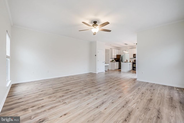 unfurnished living room featuring light wood finished floors, crown molding, baseboards, and a ceiling fan