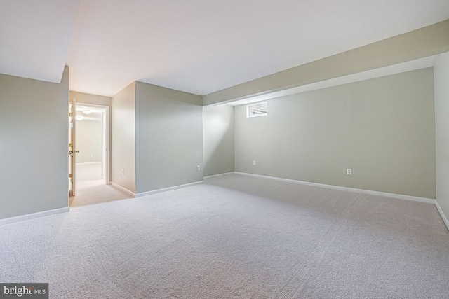 finished basement with baseboards and carpet flooring