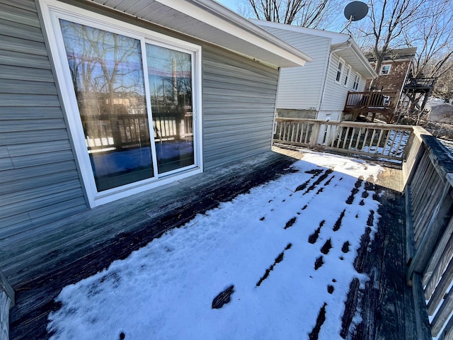 view of snow covered deck