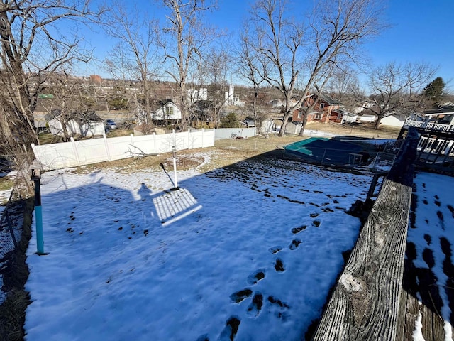 view of yard layered in snow