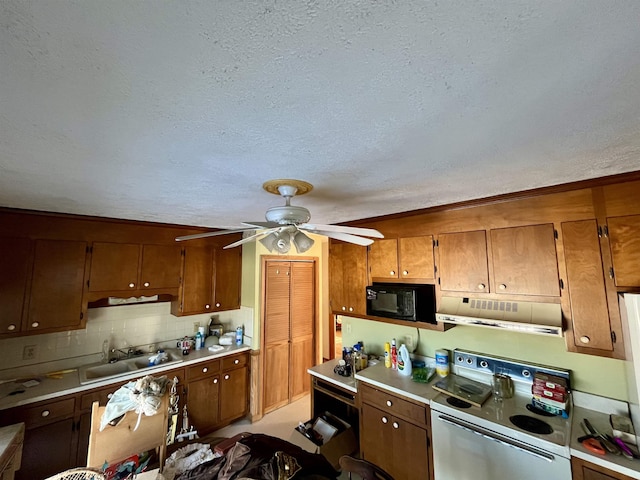 kitchen featuring white electric range oven, sink, a textured ceiling, ceiling fan, and backsplash