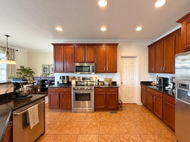 kitchen with recessed lighting, hanging light fixtures, appliances with stainless steel finishes, ornamental molding, and light tile patterned flooring