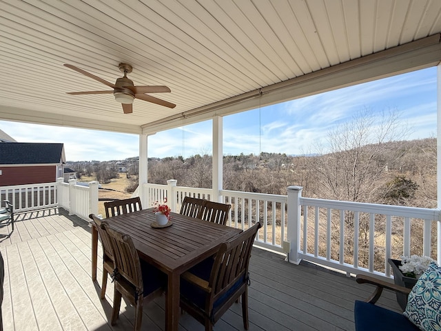 wooden deck featuring ceiling fan and outdoor dining space