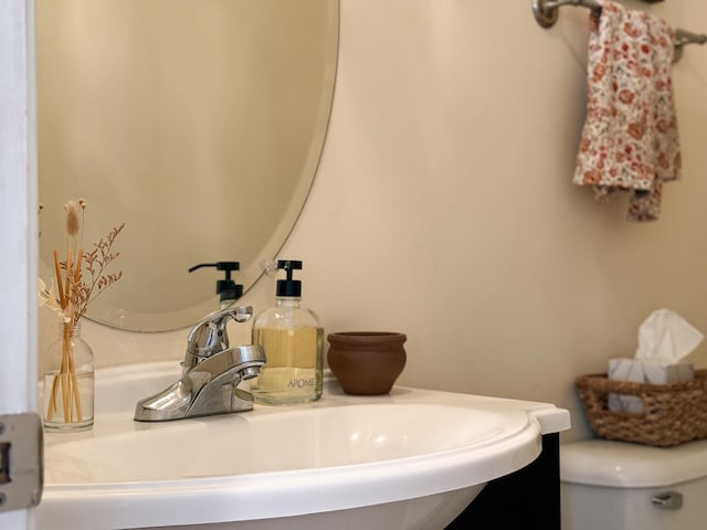 bathroom with a sink and toilet