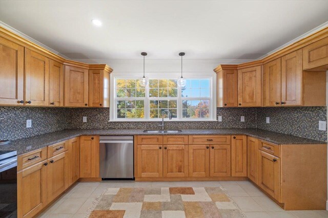 kitchen with dishwasher, a sink, decorative light fixtures, and decorative backsplash